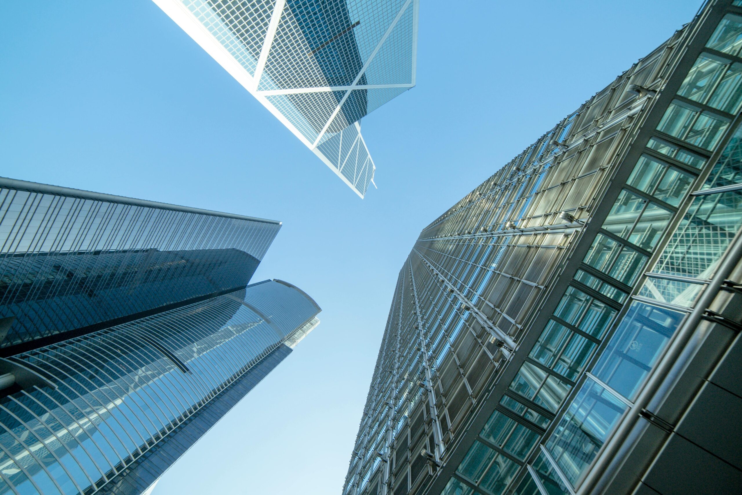 Modern skyscrapers captured from below, showcasing Hong Kong